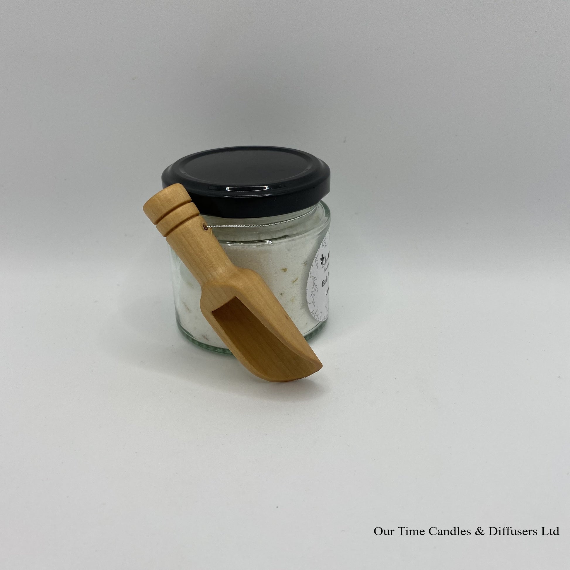 Bath Powder - Lemon product image showing filled jar with black lid and wooden scoop