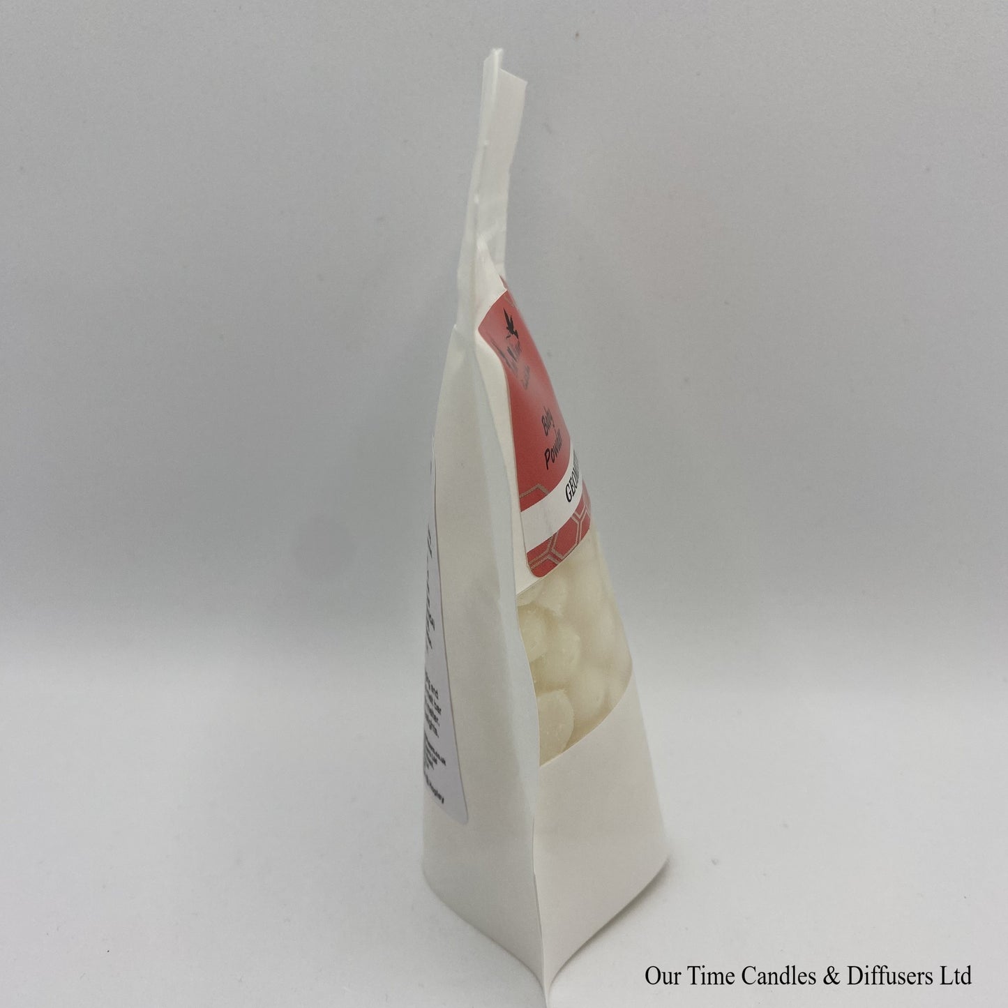 Baby Powder scented soy wax melt drops in a white bag